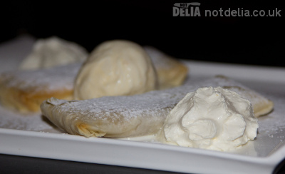 Filo apple parcels with macadamia ice cream and whipped cream